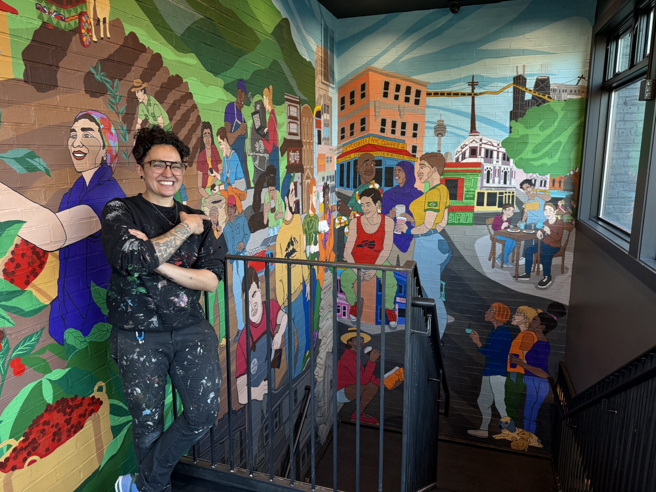 Local chicago artist Sam Kirk and the UNITED BY COFFEE Mural at the U3 Coffee Roastery & Cafe in Forest Park, IL.