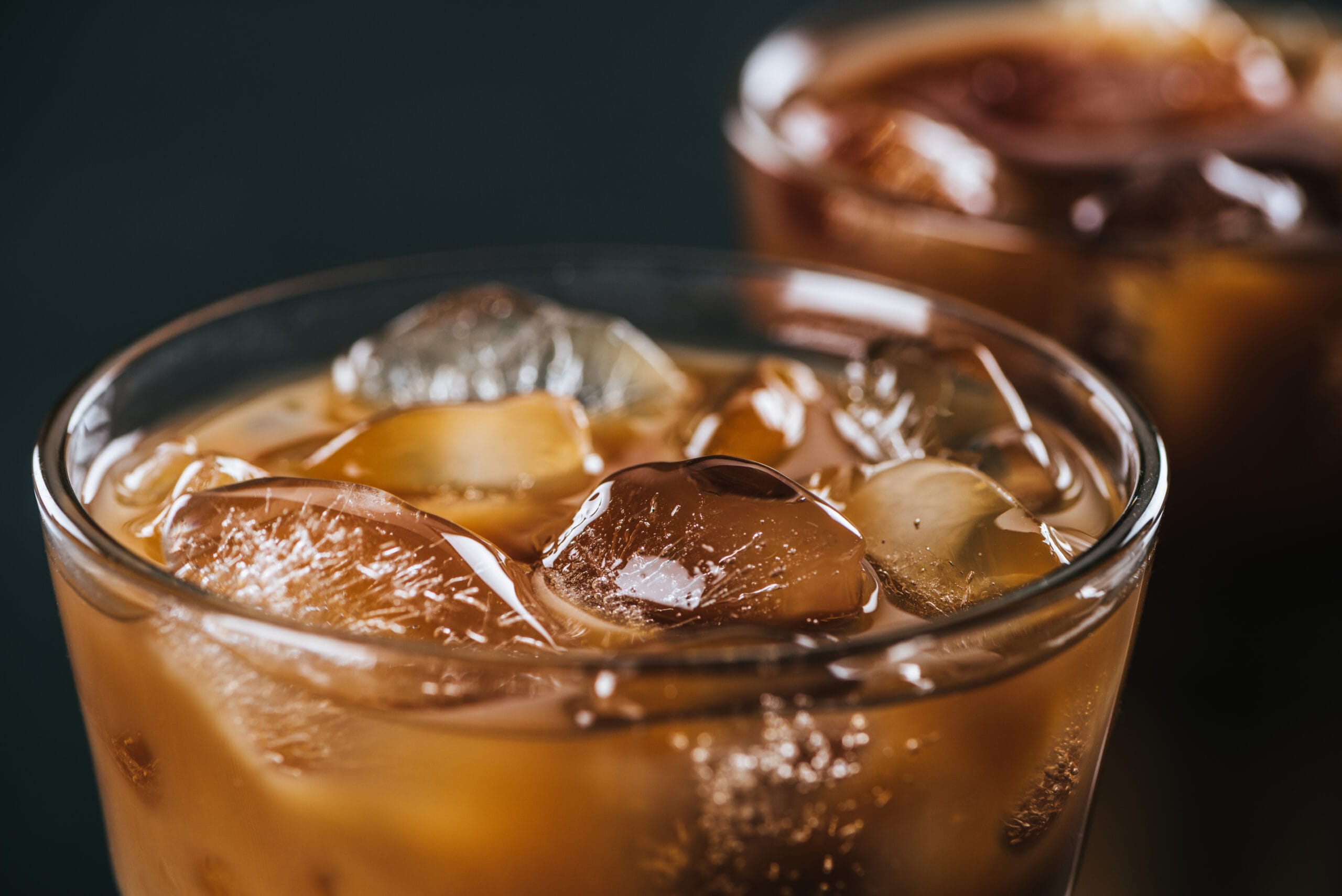 Close,Up,View,Of,Ice,Cubes,In,Cold,Brewed,Coffee Discover how to make cold brew coffee at home! Learn the method, pick the perfect beans, and discover our favorite cold brew pitcher.