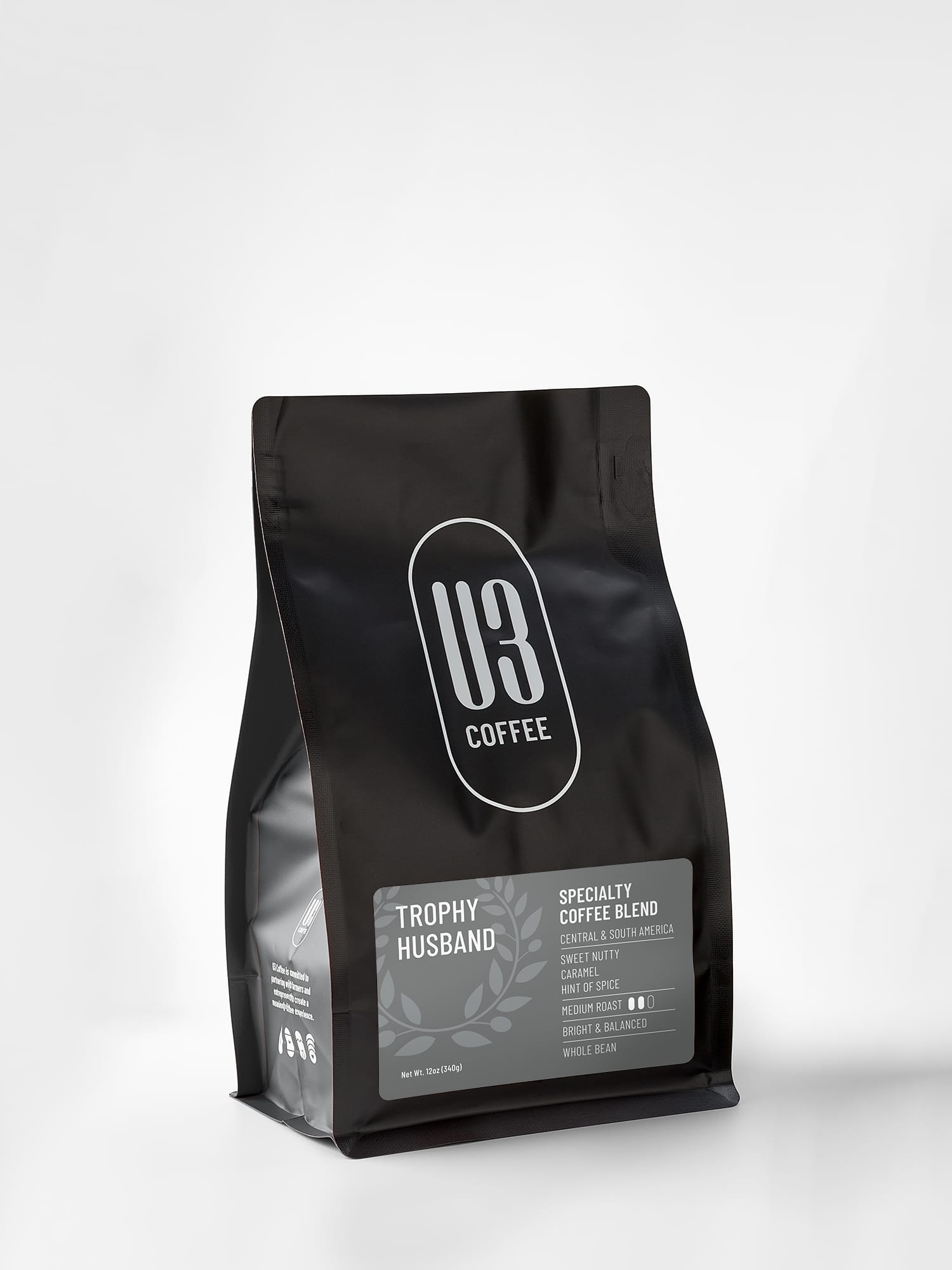12oz. bag of Trophy Husband medium roast blend of Central & South American beans from U3 Coffee.